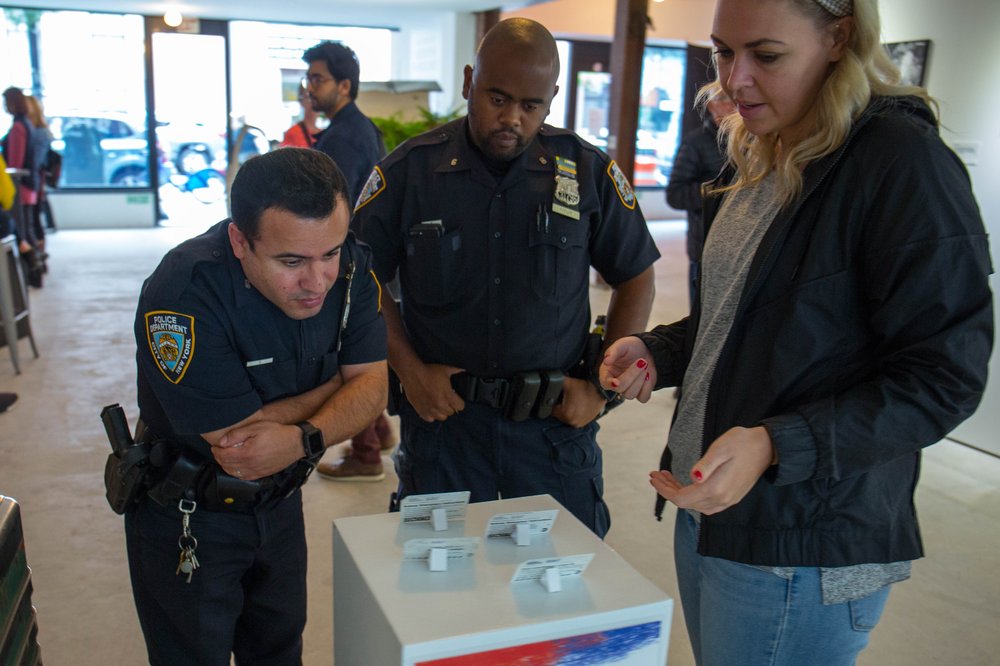 Police officers look at the exhibit<br>
