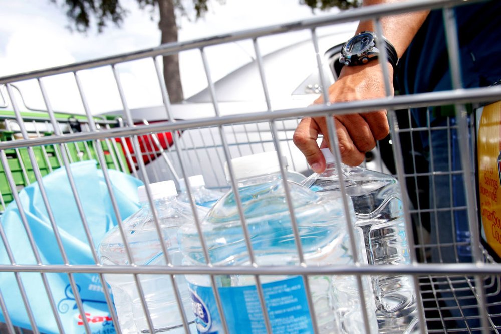 2cf73a0c0gettyimages-843059522-jpg.jpeg Carlos Otero, of St. Petersburg, loads his car with water bottles outside of a Publix grocery store as residents in the area prepare ahead of Hurricane Irma on September 05, 2017 in St. Petersburg, Florida. (Getty Images)