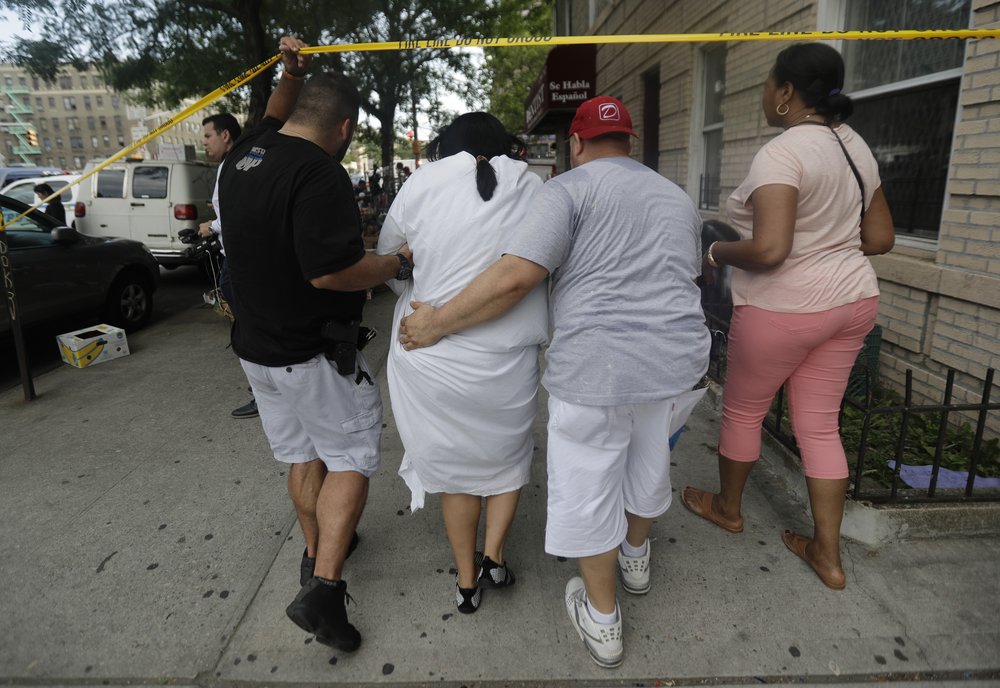 2d9a07352hospital-shooting_chun-jpg.jpeg Plainclothes police officers help a patient leave (AP)
