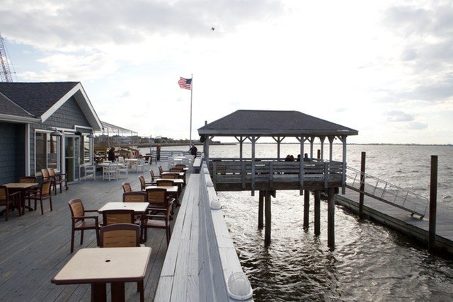 2thewharf14.jpg THE WHARFThe Wharf is sort of hidden behind a gas station off Beach Channel Drive, but it's worth finding. Once there, grab a drink at the bar and have a seat out on the back deck, where you may even see some local patrons arriving by boat. This is your no frills, spacious dive bar with a fantastic viewâand it's pretty perfect as is. It can get rowdy at times, but you'll often find you have the place to yourself if it's not too late. (Jen Carlson)416 Beach 116th Street // Yelp // Facebook