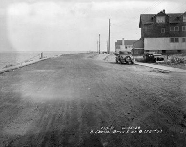 30512oldrock.jpeg "Beach Channel Drive, East on Beach 132nd Street. Road, water at left, houses at right. October 25, 1928."