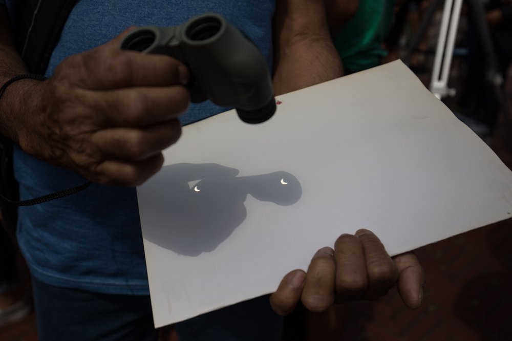 34db96a20img_4960-jpg.jpeg Mohammed Ismail used binoculars to view the eclipse<br>