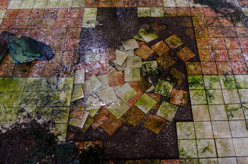 Displaced tilework, natatorium.