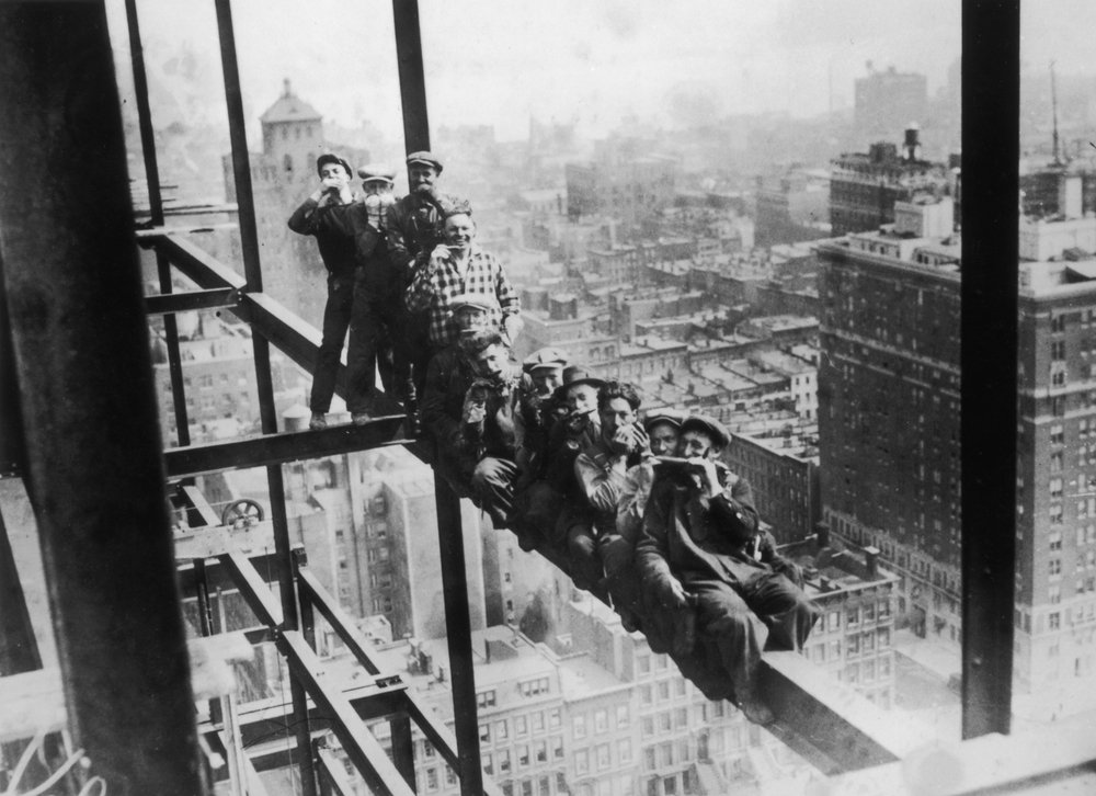 363d8109c.jpeg Harmonica playing steel workers perched on a girder on the 22nd storey of the Murray Hill building, New York, 1930.