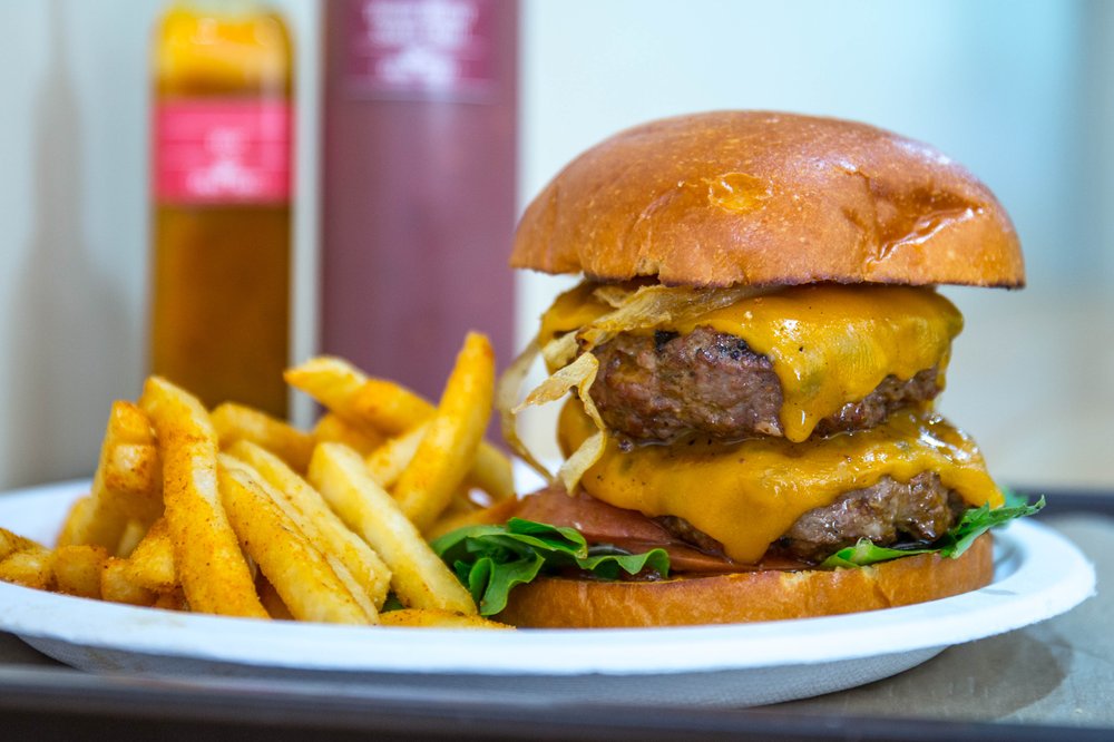 377e305daperi-8-jpg.jpeg Eight-ounce Beef Burger ($10.99) with Peri Peri Fries ($2.99)<br/>