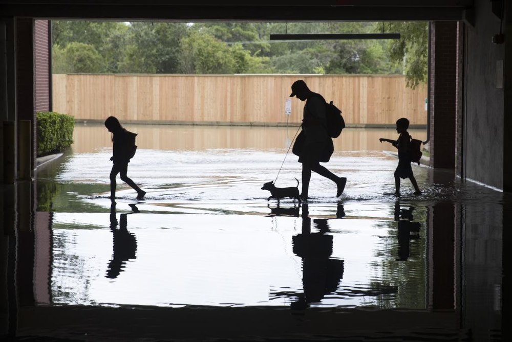 395a5898egettyimages-840980904-jpg.jpeg The Martinez family evacuates the apartment complex they live in near the Energy Corridor of west Houston, Texas where high water coming from the Addicks Reservoir is flooding the area after Hurricane Harvey on August 30, 2017 in Houston, Texas<br>(Getty Images)