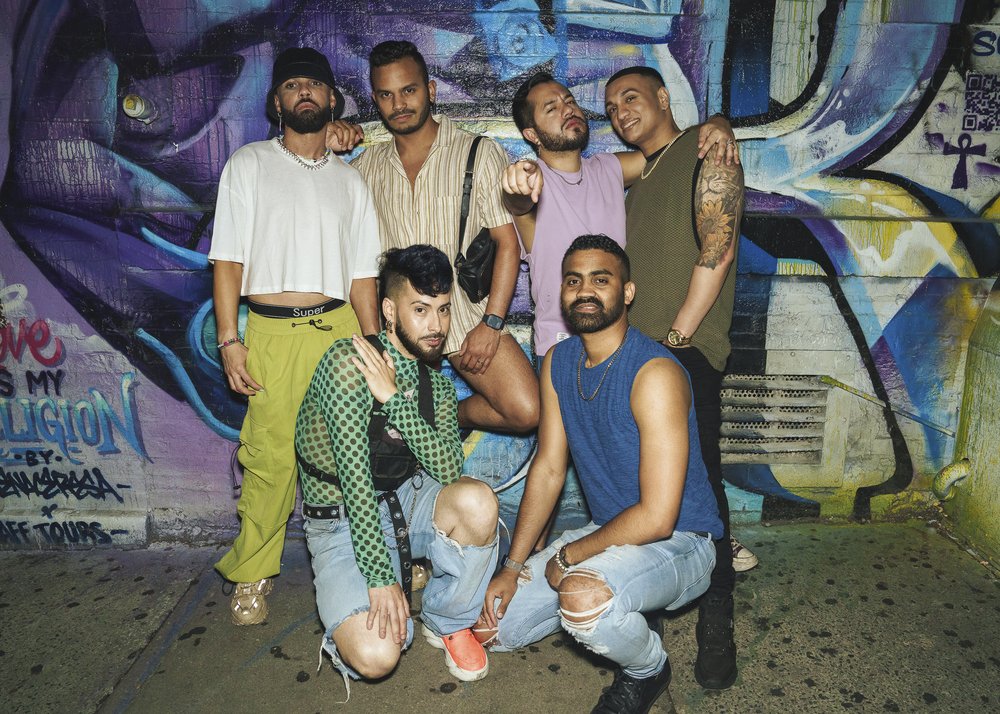 A group of six poses for a photo.
