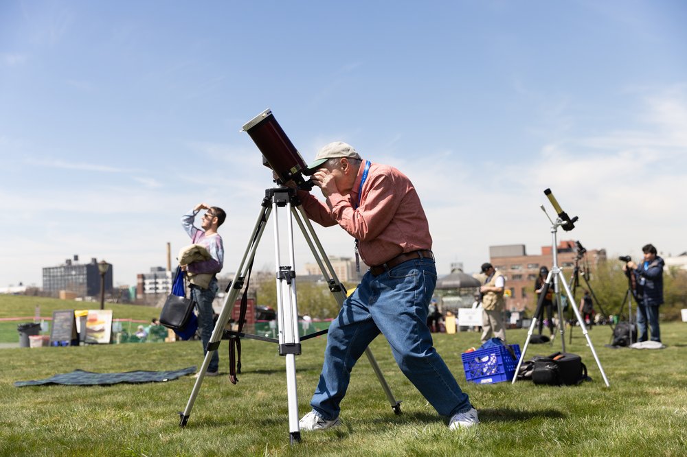 3M3A8683.jpg Joe Delfausse from the Amateur Astronomers Association sets up his telescope for the solar eclipse at Greenwood Cemetery in Brooklyn, New York on April 8, 2023.