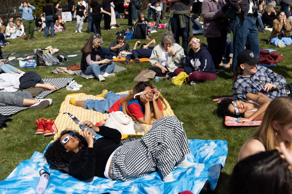 3M3A8778.jpg Mattaniah Aytenfsu and Naja Stafford watch the solar eclipse at Greenwood Cemetery in Brooklyn, New York on April 8, 2023.