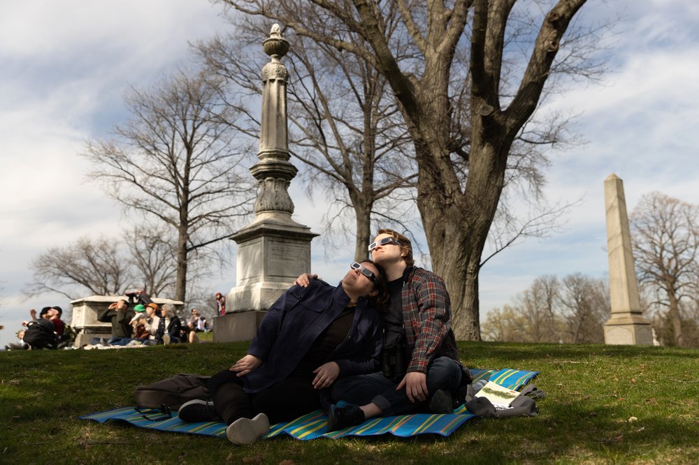 3M3A8834.jpg Melissa Sions and Andrew Sherman watch the solar eclipse at Greenwood Cemetery in Brooklyn, New York on April 8, 2023.