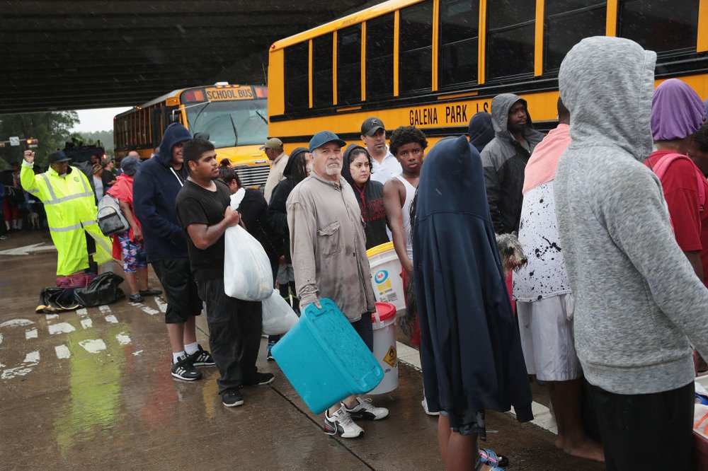 3a090b80cgettyimages-840308486-jpg.jpeg People wait for a ride to a shelter after being rescued from a flooded neighborhood when it was inundated with rain water, remnants of Hurricane Harvey, on August 28, 2017 in Houston, Texas<br>
