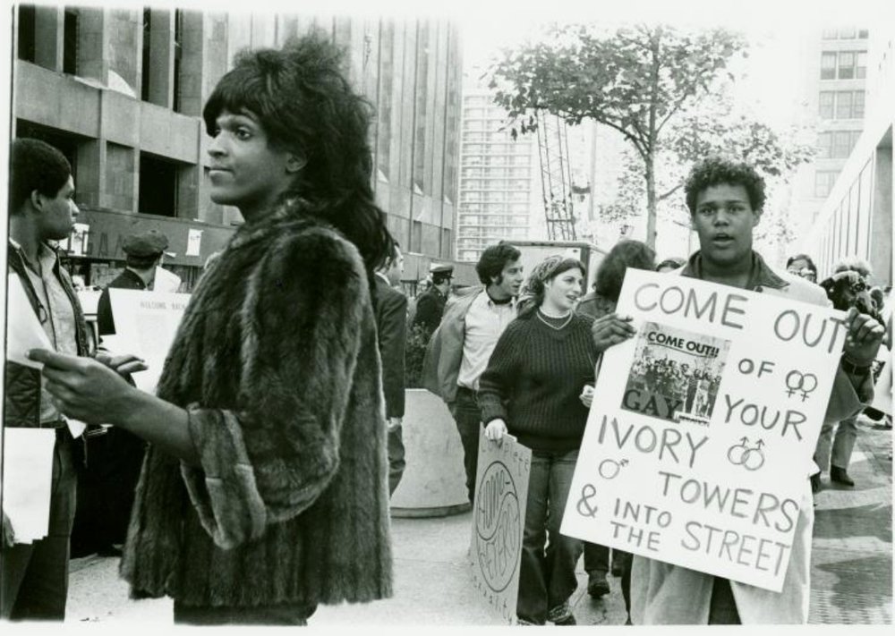 Marsha P. Johnson hands out flyers for support of gay students at NYU<br/>