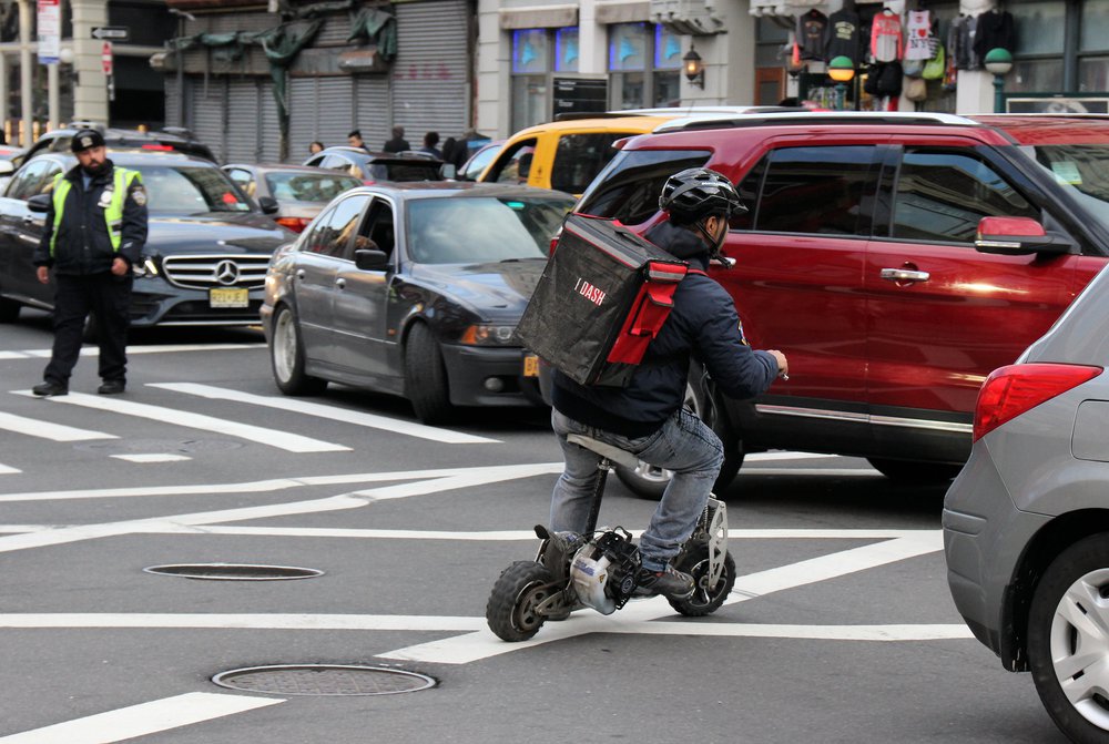 A photo of a delivery person in Manhattan