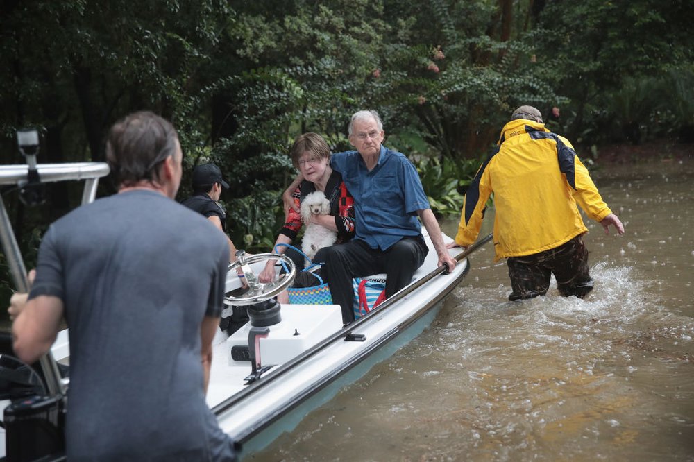 40a687329gettyimages-839916728-jpg.jpeg Volunteers and officers from the neiborhood security patrol help to rescue residents in the upscale River Oaks neighborhood after it was inundated with flooding from Hurricane Harvey on August 27, 2017 in Houston, Texas<br>