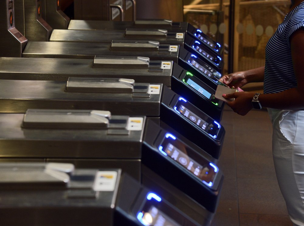 A view of the OMNY readers on subway turnstiles