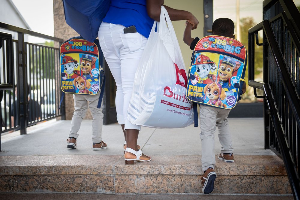 Young kids walk to school.