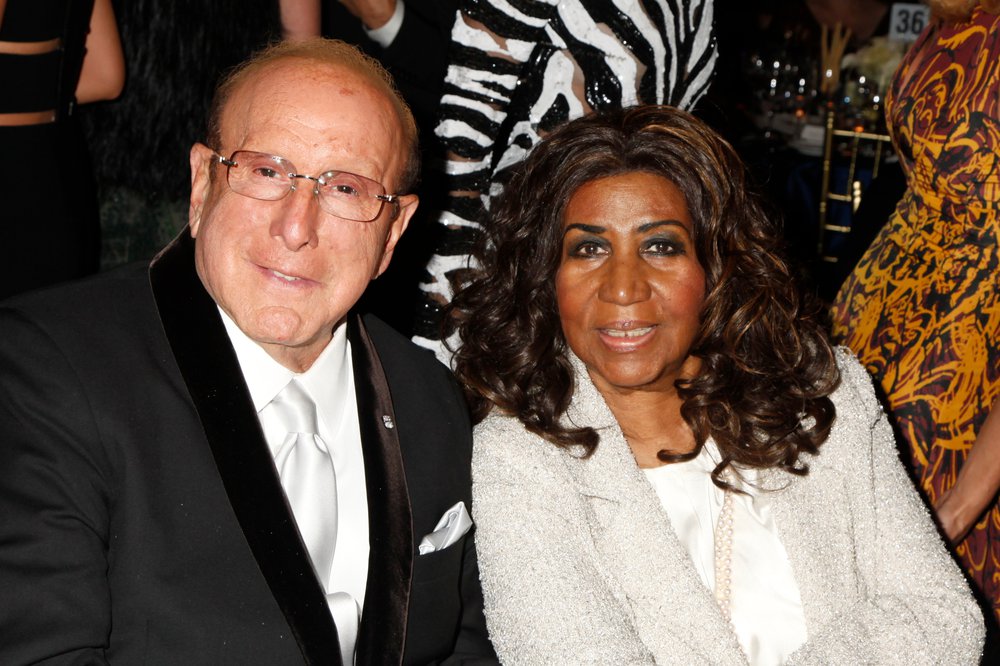 4af7c08d7shutterstock_3232156bb-jpg.jpeg With Clive Davis in 2013 (Gregory Pace/BEI/Shutterstock)