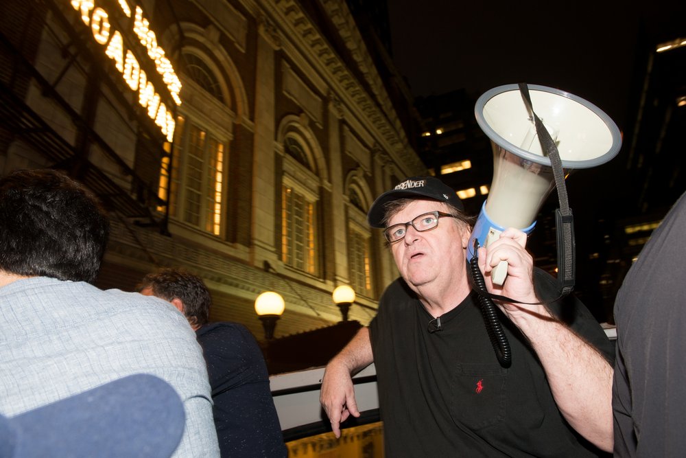 4b2829fa1gettyimages-832239764-jpg.jpeg Michael Moore outside the Belasco<br>