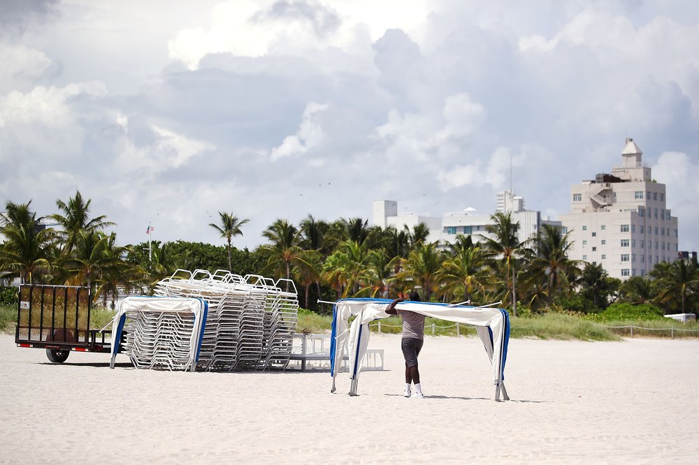 4bbcda54e090717_irma8-jpg.jpeg A concessioner worker removes beach awnings in preparation for approaching Hurricane Irma on September 6, 2016 in Miami Beach. (Photo by Mark Wilson/Getty Images)