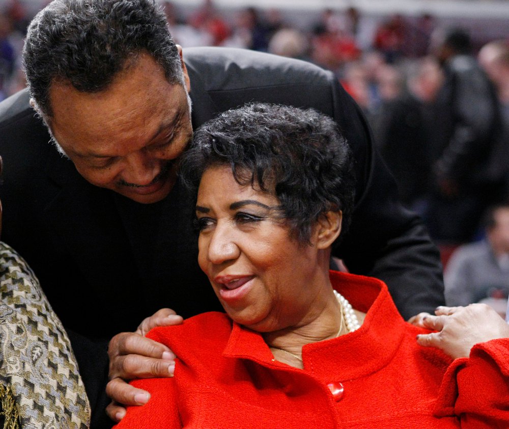 4dc5cf1f0shutterstock_6290569k-jpg.jpeg The Rev. Jesse Jackson and Franklin at a Washington Wizards game in 2011 (AP/Shutterstock)