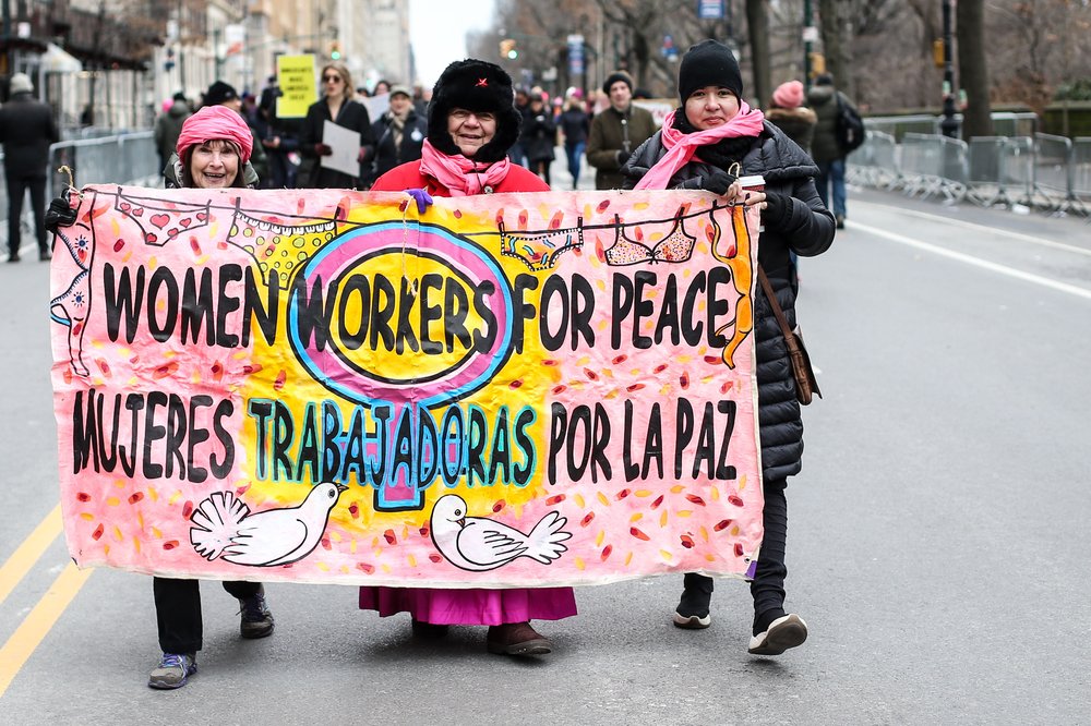 People participating in the NYC Women's March (William Volcov/Shutterstock)