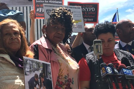 From left: Iris Baez, the mother of Anthony Baez, who was killed by a chokehold administered by an NYPD officer in 1994; Gwen Carr, Eric Garner's mother; and Loyda Colon, co-director of the Justice Committee, outside of police headquarters on Tuesday afternoon
