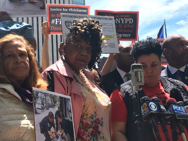 From left: Iris Baez, the mother of Anthony Baez, who was killed by a chokehold administered by an NYPD officer in 1994; Gwen Carr, Eric Garner's mother; and Loyda Colon, co-director of the Justice Committee, outside of police headquarters on Tuesday afternoon