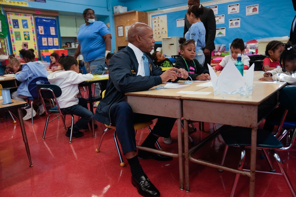 Mayor Adams with kids in a classroom.