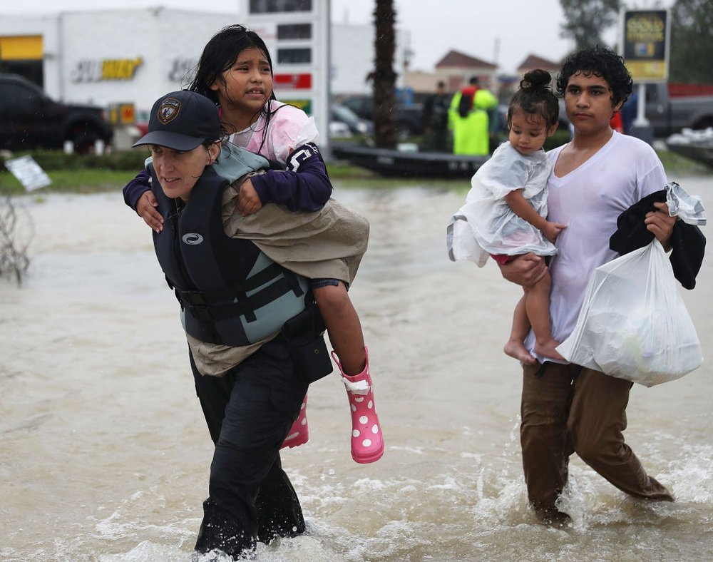52d885ac6gettyimages-840331556-jpg.jpeg Evacuees are helped to dry land after their homes were inundated with flooding from Hurricane Harvey on August 28, 2017 in Houston, Texas<br>