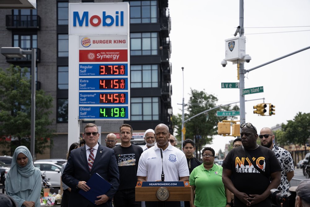 Mayor Eric Adams speaks at a press conference at a Mobil gas station.