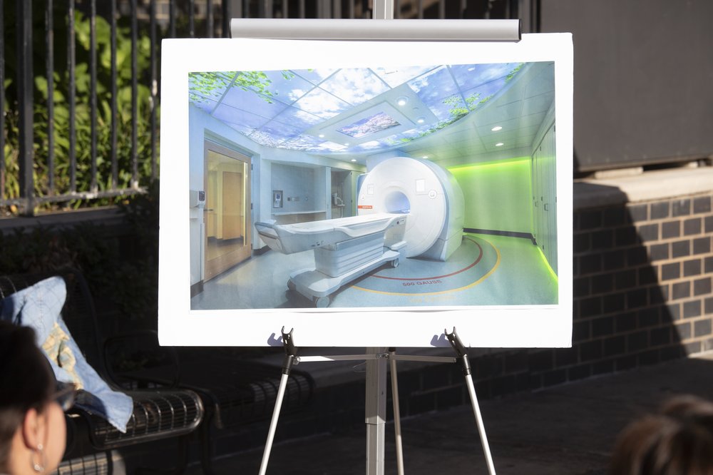 Hospital staffers and New York City lawmakers celebrate a major boost in funding for Elmhurst hospital on Monday, Oct. 23, 2023.