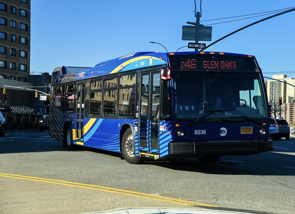 A bus makes a left turn in Queens, New York City.