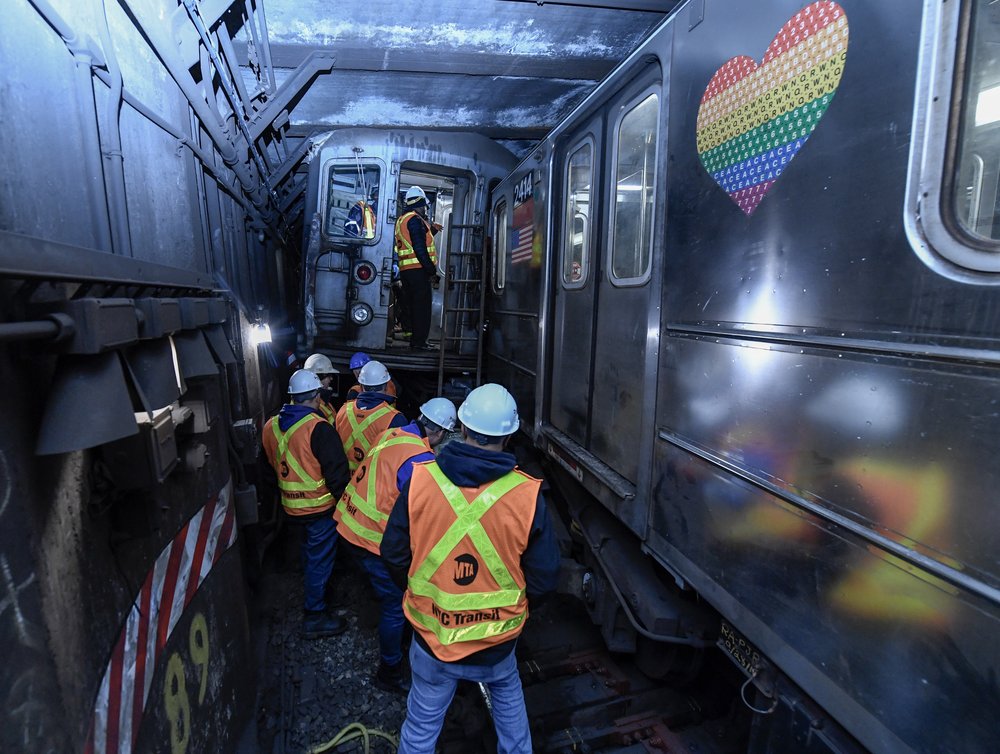 Emergency crews respond to the train derailment in Manhattan on Thursday.