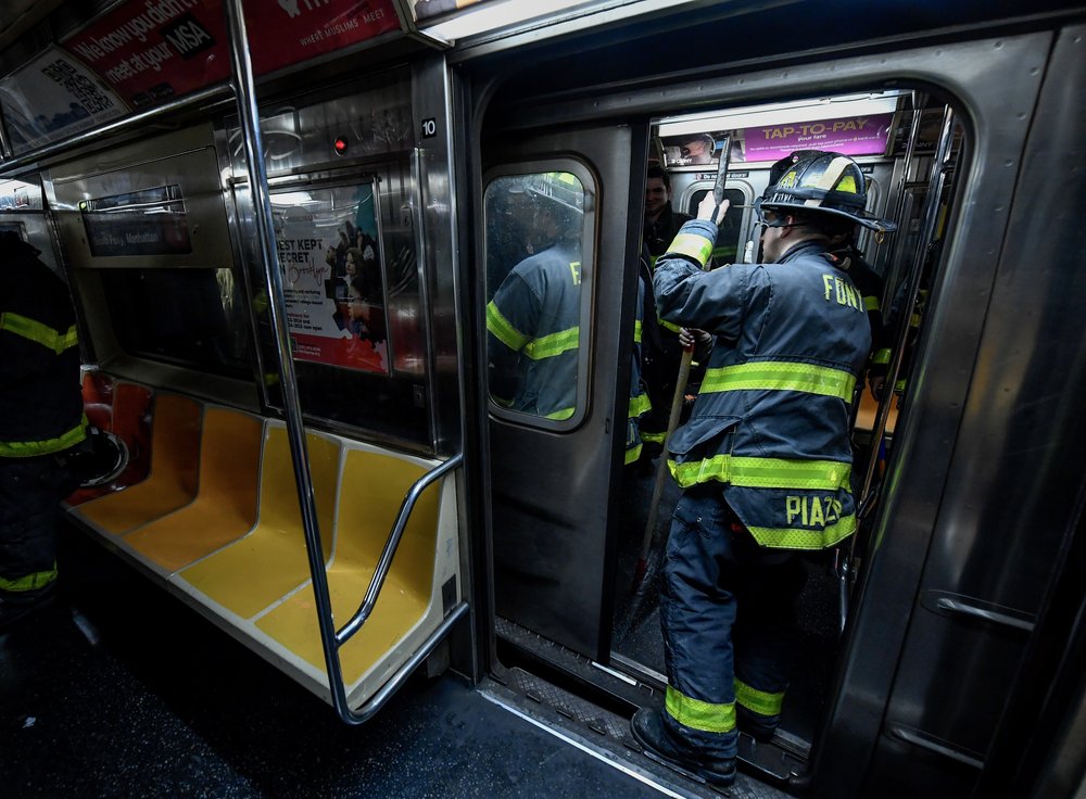 Emergency crews respond to the train derailment in Manhattan on Thursday.