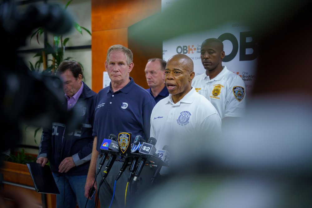 Mayor Eric Adams speaks to the media from the hospital where an officer was being treated after Sunday's NYPD subway shooting in Brooklyn.