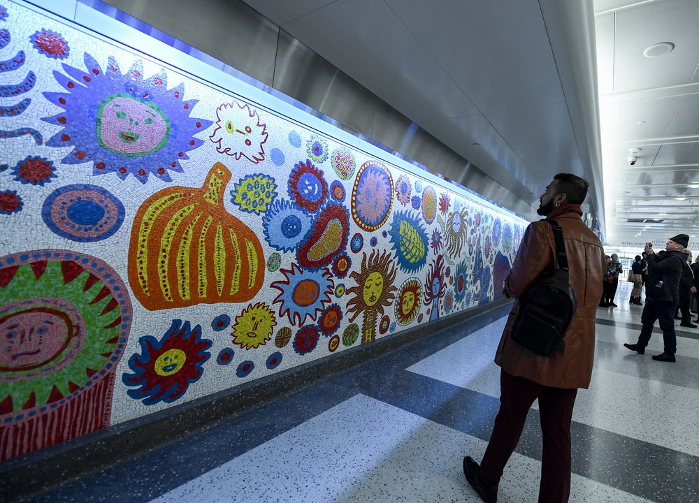 A man looks at an art installation in Grand Central Madison.