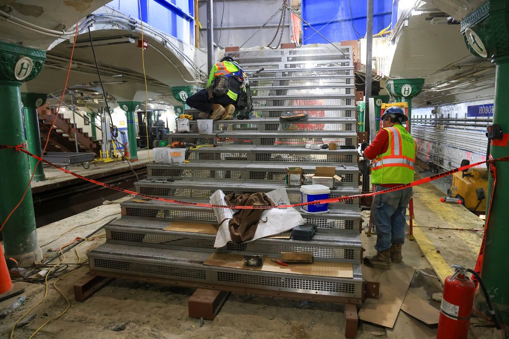 Crews work on installing one of four new staircases that will connect the mezzanine to the platform level. The Port Authority says these wider, steel staircases will replace the station’s original steep and narrow concrete steps, which date back 117 years.