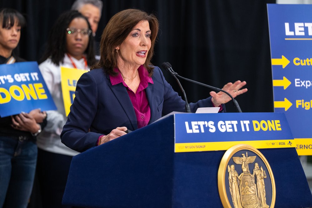 Gov. Kathy Hochul at a podium that says let's get it done