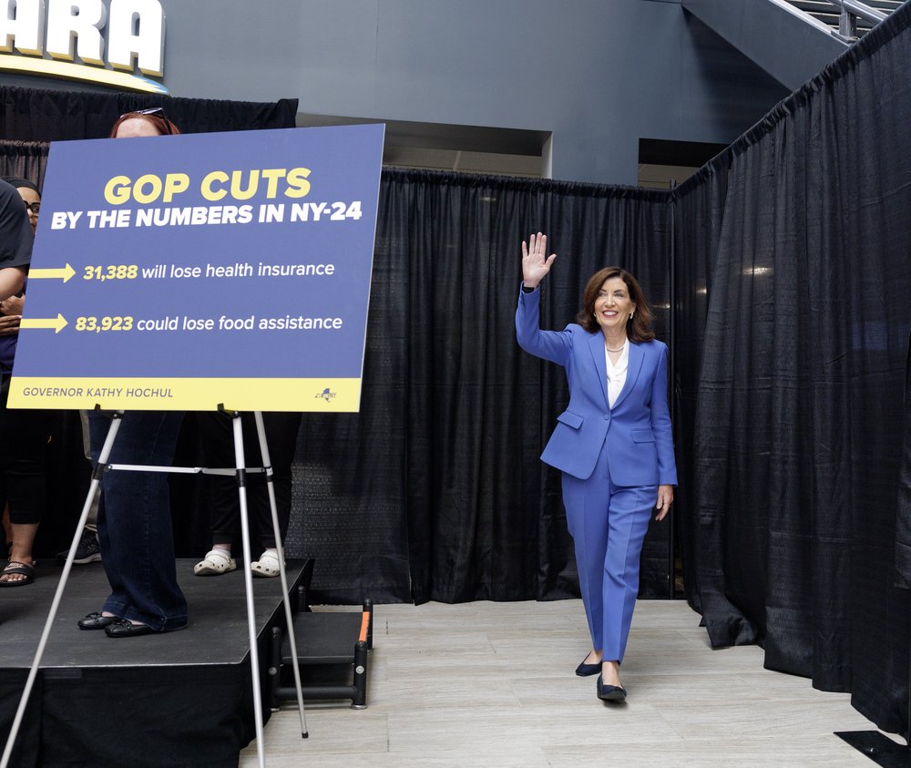 Gov. Hochul emerges onto a stage.
