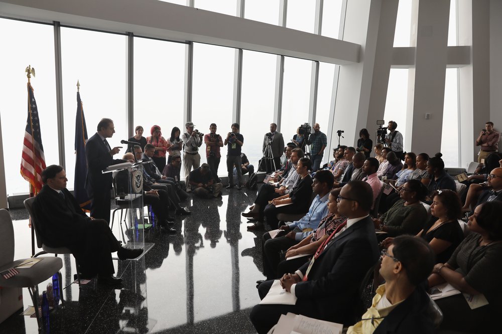 550aa267agettyimages-831852034-jpg.jpeg Former U.S. Attorney Preet Bharara addresses new American citizens at a naturalization ceremony in the observatory of One World Trade Center<br>