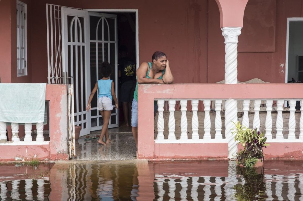 58be1e15e092517gettypuertorico4-jpg.jpeg Residents look at flood waters days after Hurricane Maria made landfall, on Friday, September 22 in Loiza, Puerto Rico. (Alex Wroblewski/Getty Images)
