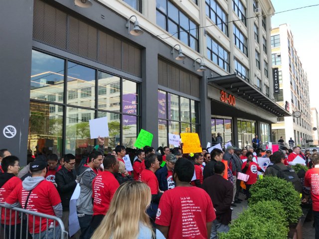 Drivers rally outside Uber's headquarters in Long Island City on Wednesday