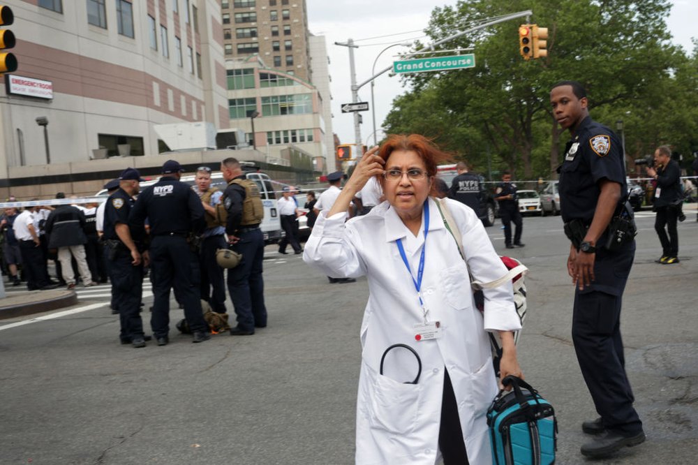 5c22e0af2gettyimages-804691862-jpg.jpeg Staff leave Bronx Lebanon Hospital (Getty Images)