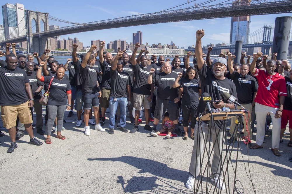 5fc4cef5cap17231635026466-jpg.jpeg Retired New York City Police Deputy Inspector and author Corey Pegues is surrounded by members of law enforcement as he speaks during a rally to show support for Colin Kaepernick<br>