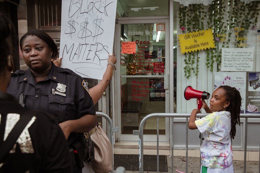 5fd2aec9020180807gothamist_nailsalonprotest-11-jpg.jpeg Outside another nail salon at 1224 Nostrand Avenue<br>