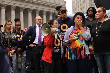 Melani Brown, Polanco's sister, speaks to the crowd at Foley Square.