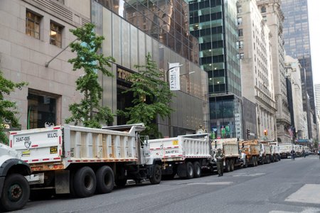 Sanitation department trucks line Fifth Avenue outside Trump Tower, in New York on May 16, 2019