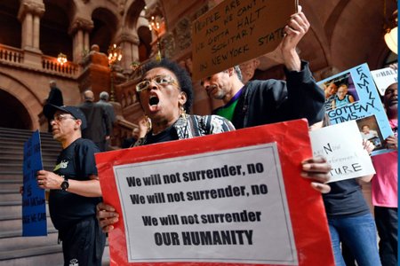 Nathylin Flowers marches with protesters against solitary confinement at New York state correctional facilities, during a rally to urge New York state legislators to pass reform legislation at the state Capitol, in Albany on Wednesday