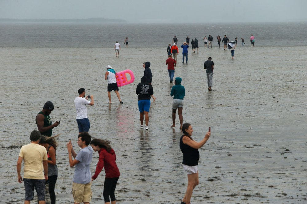 62335ae8bgettyimages-845356344-jpg.jpeg TAMPA, FL - SEPTEMBER 10: Residents inspect the extreme receding water in Tampa Bay ahead of Hurricane Irma on September 10, 2017 in Tampa, Florida. Hurricane Irma made landfall in the Florida Keys as a Category 4 storm on Sunday, lashing the state with 130 mph winds as it moves up the coast. (Photo by Brian Blanco/Getty Images)