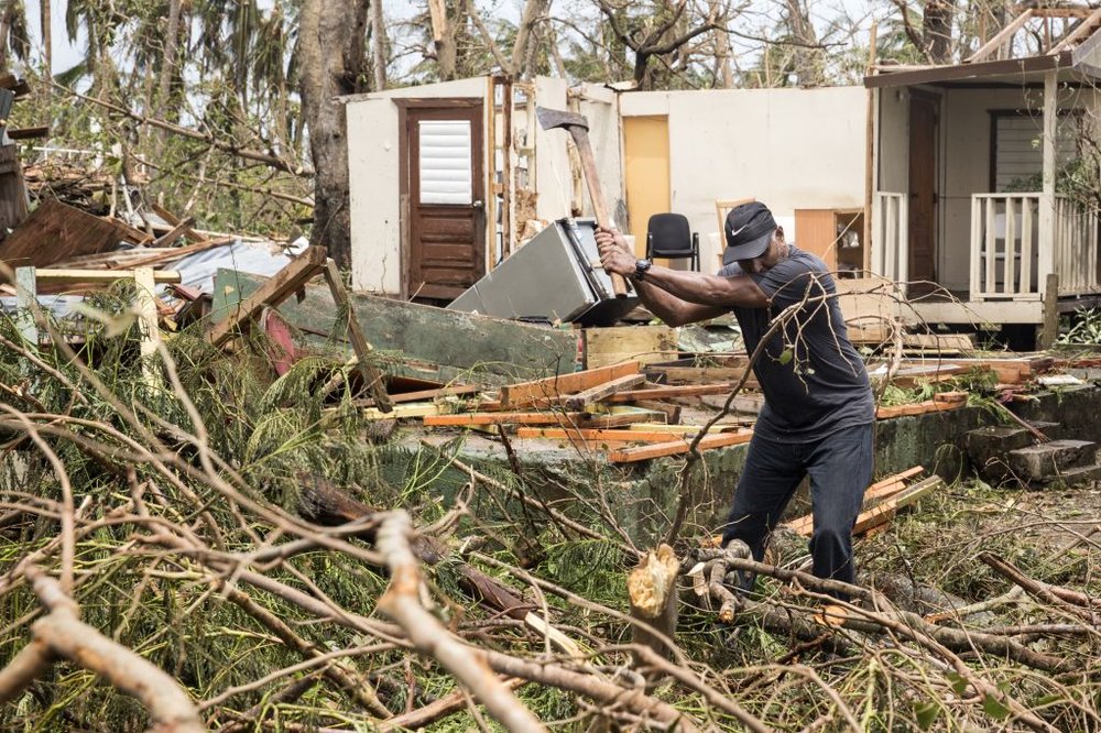 658a2d9fa092517gettypuertorico7-jpg.jpeg A resident clears debris days after Hurricane Maria made landfall in Loiza, Puerto Rico. (Alex Wroblewski/Getty Images)
